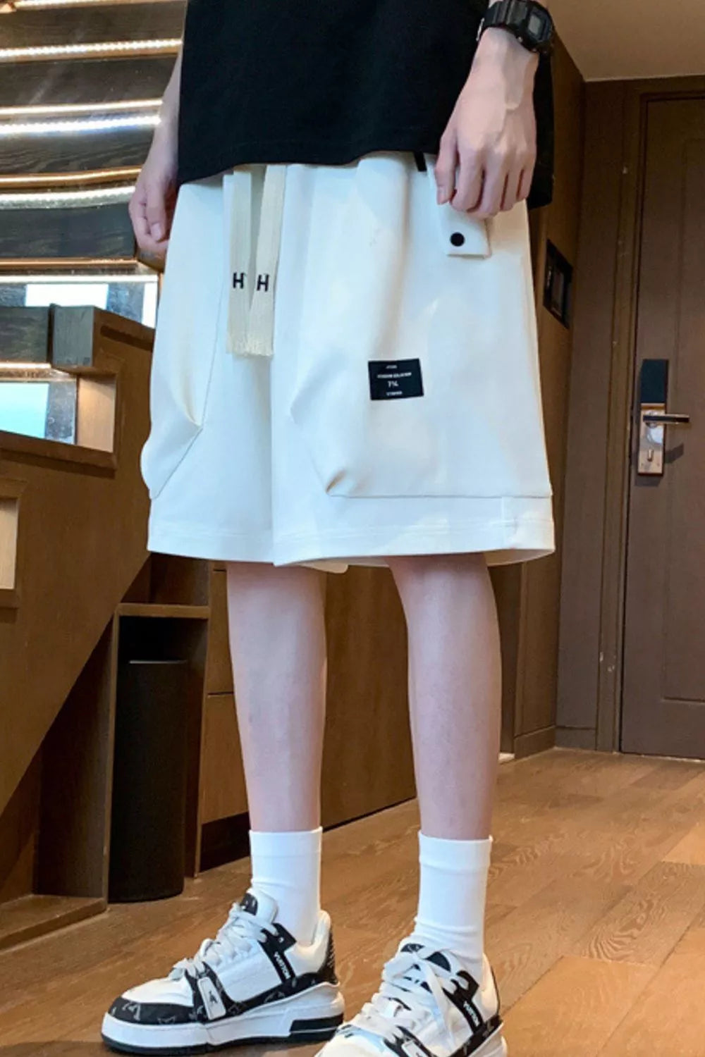 Men's lightweight shorts with a drawstring waist and pockets.