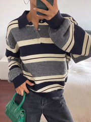 On-model front view of the striped polo sweater with its button placket partly open