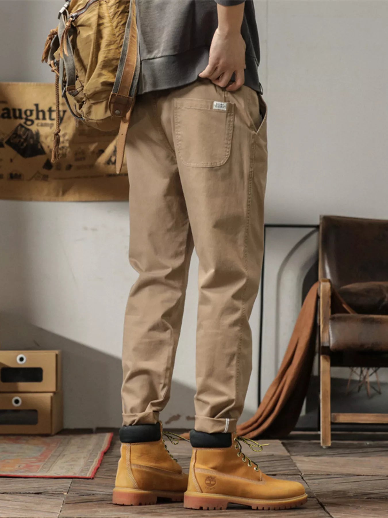 Men's slim fit casual pants with banded ankles and pockets.