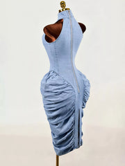 Light blue sleeveless mock neck ruched bodycon denim dress on mannequin, back side view with zip
