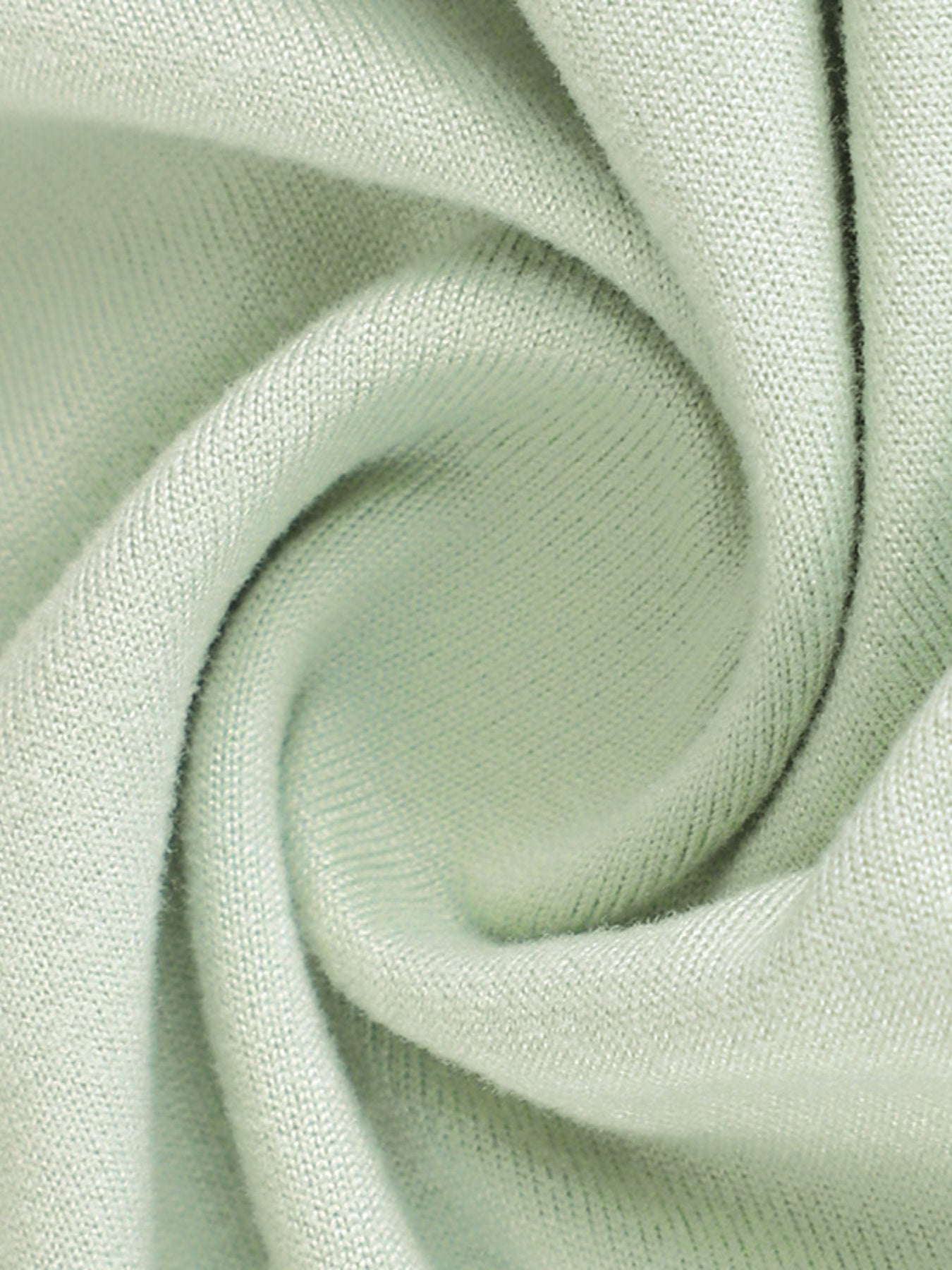 Close view of light green fabric texture on a floral bodycon mermaid maxi dress