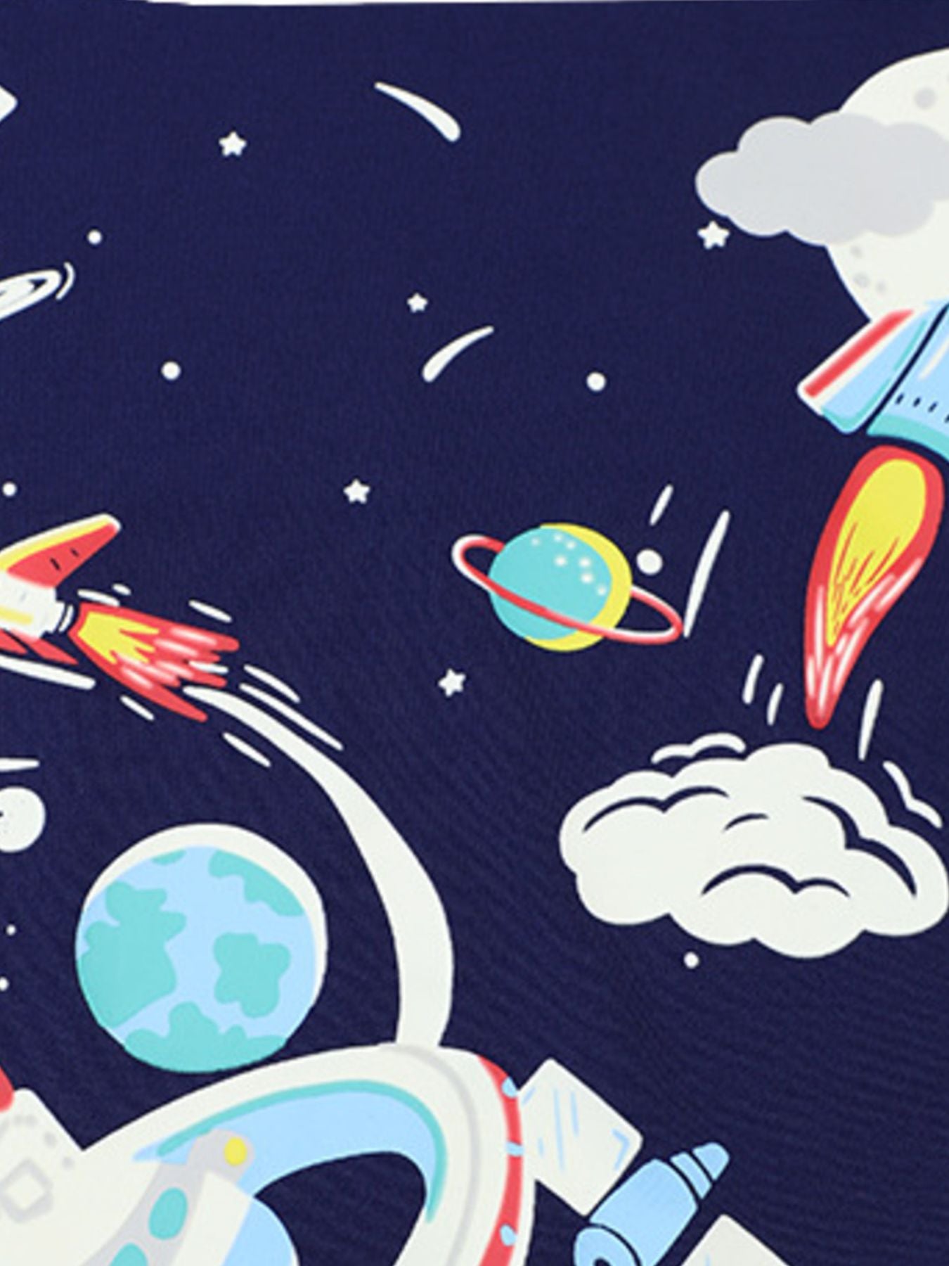 Close view of the navy children's tee space print showing rockets planets and a ringed planet