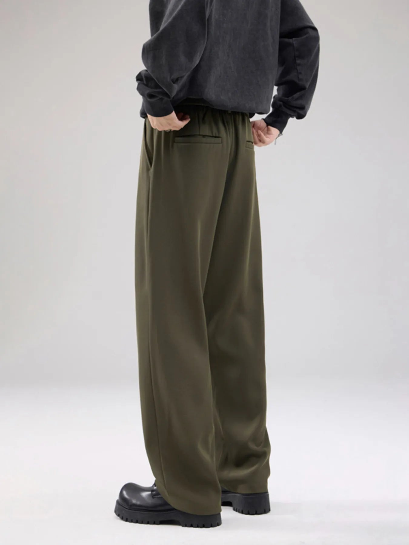Men's wide leg pants with a drawstring waist and pockets.