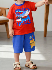 Children's red crew-neck T-shirt featuring a cartoon shark print and short sleeves.