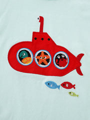 Close detail of the red embroidered submarine with sea creatures in its round porthole windows