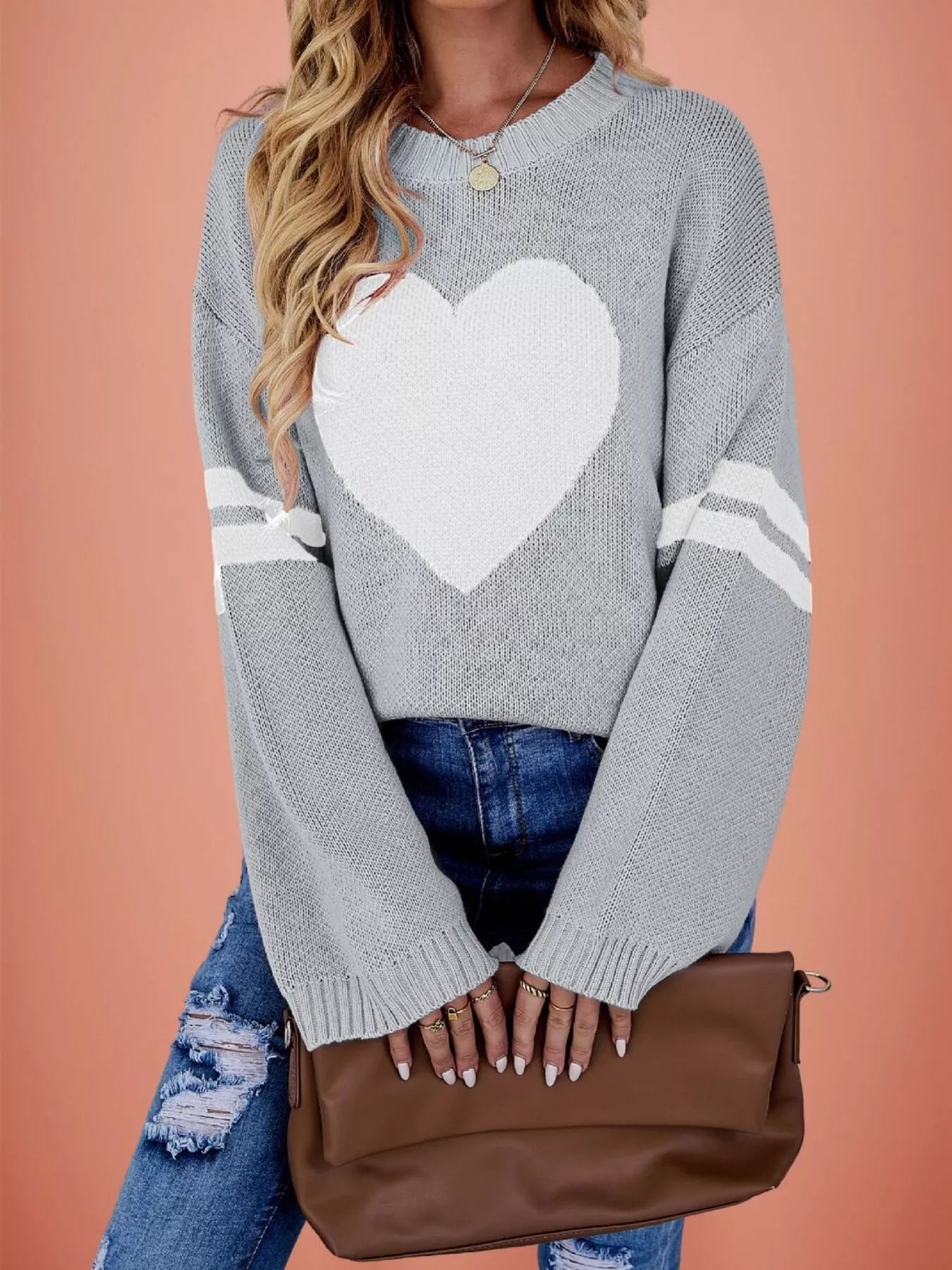 Front view of a gray dropped shoulder sweater with a large white heart