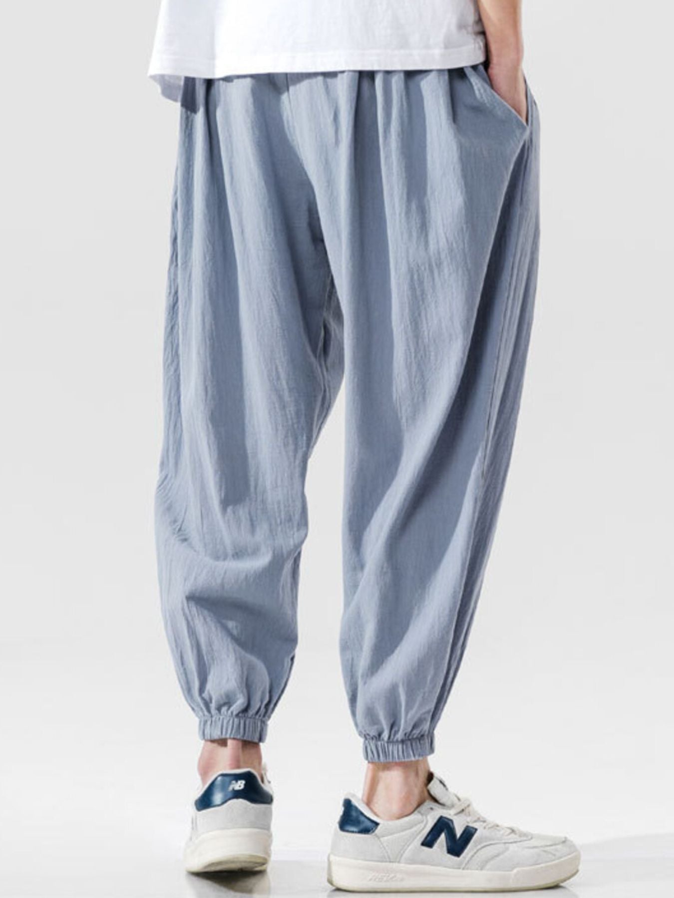 Men's loose fit joggers with a drawstring waist and pockets.