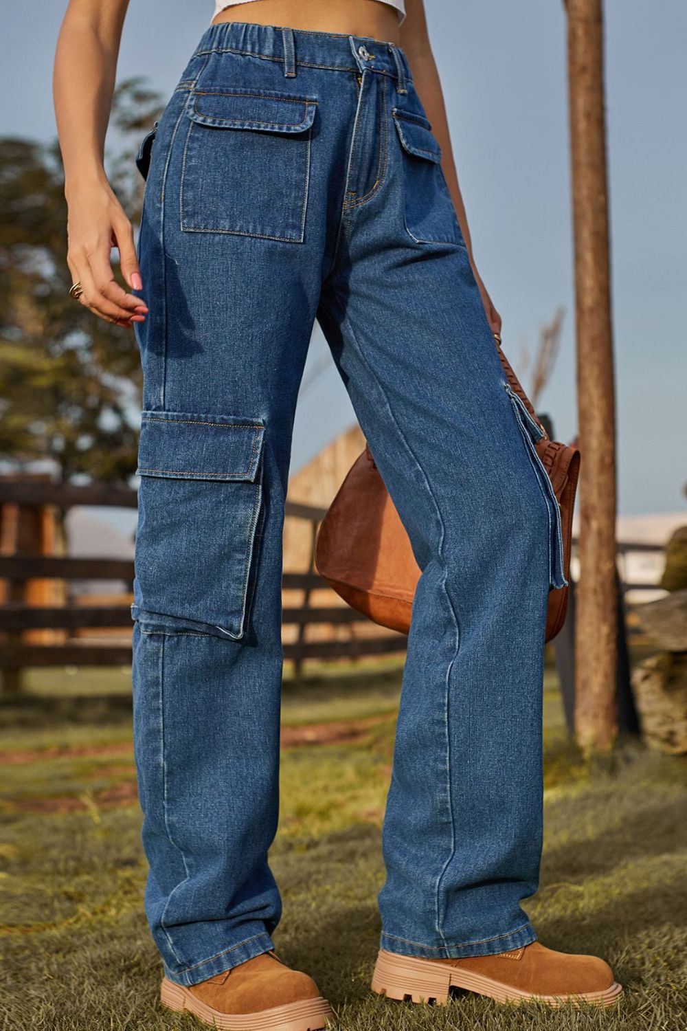 Women's loose-fit long jeans with pockets in a non-stretch rayon blend.