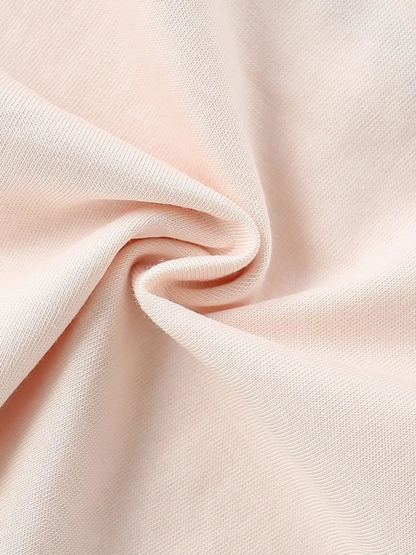 Close-up of the soft watermelon pink fabric showing its texture and drape