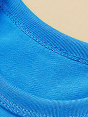 Close-up of the ribbed crew neckline and stitching on a sky blue children's t-shirt