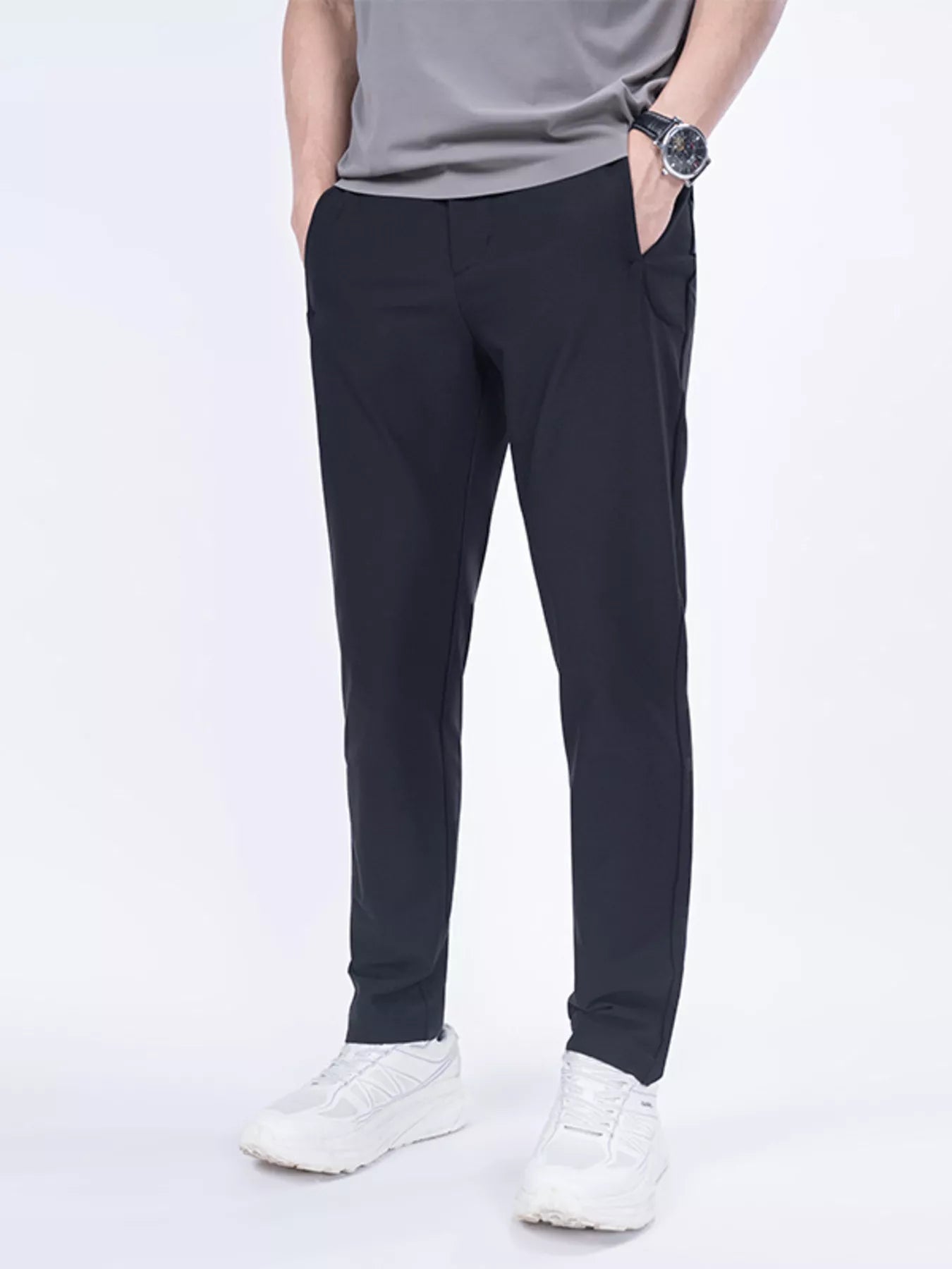Men's black slim-fit casual pants with pockets, available in plus sizes.