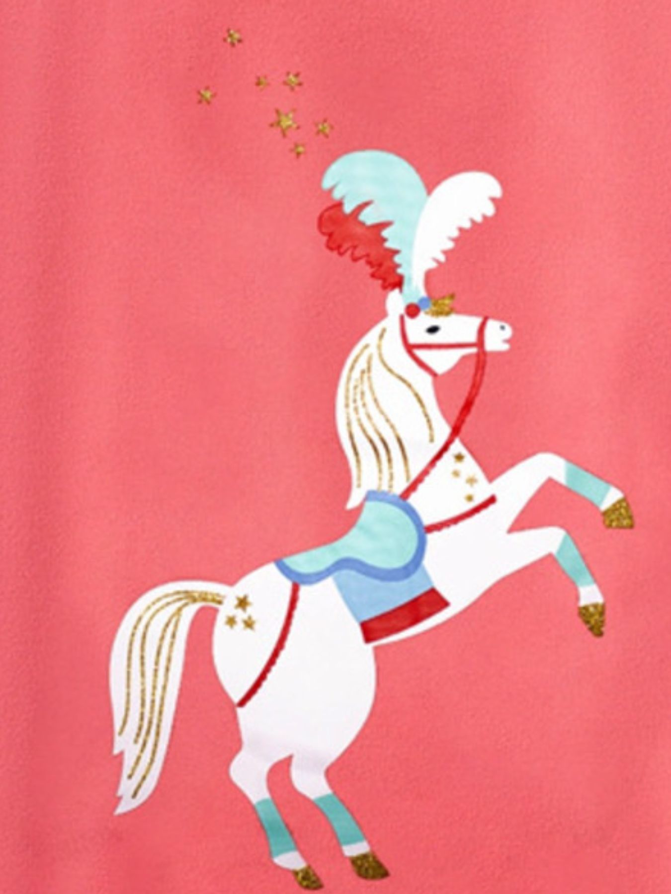 Close-up of white cartoon horse graphic with feathered headdress and gold stars on coral t-shirt