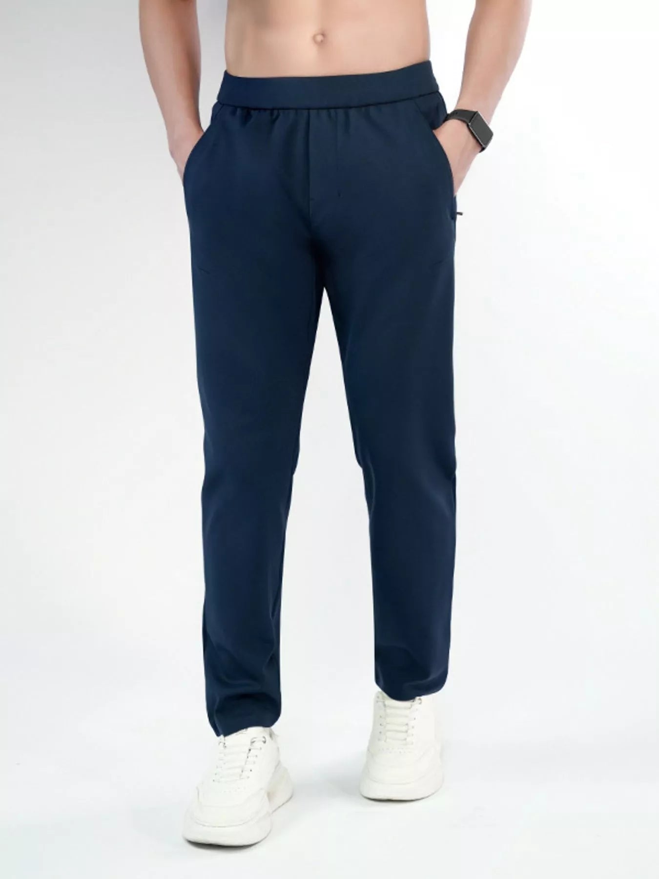 Men's navy slim-fit pants with a drawstring waist and pockets.
