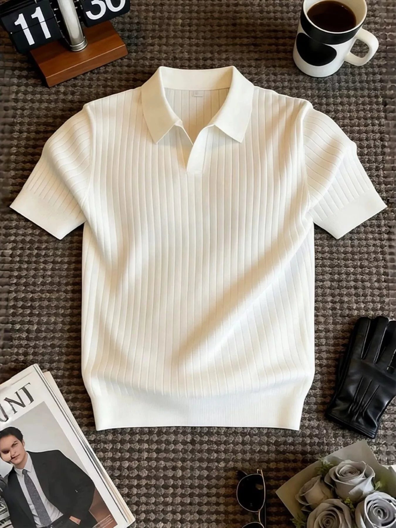 Men's ribbed knit polo shirt with a classic collar and seam details.