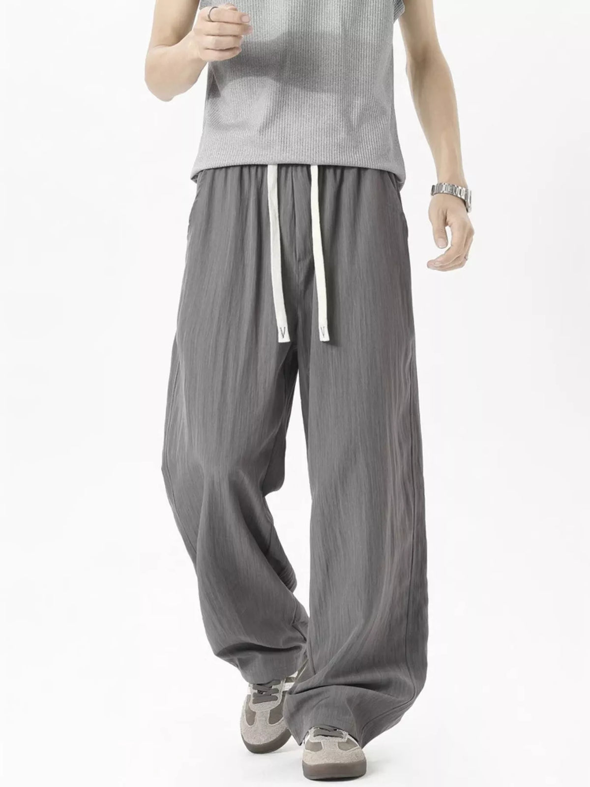 Men's lightweight loose fit casual pants with a drawstring waist.