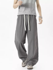 Men's lightweight loose fit casual pants with a drawstring waist.