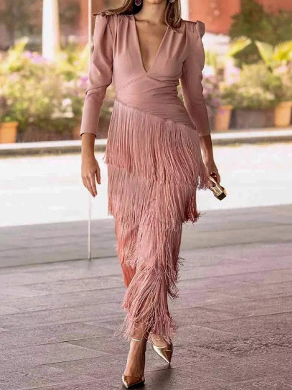 Pink long sleeve V neck midi dress with tiered fringe skirt, front full view on model