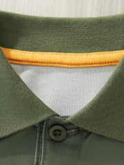 Close-up detail of the army green polo collar with yellow inner trim and button