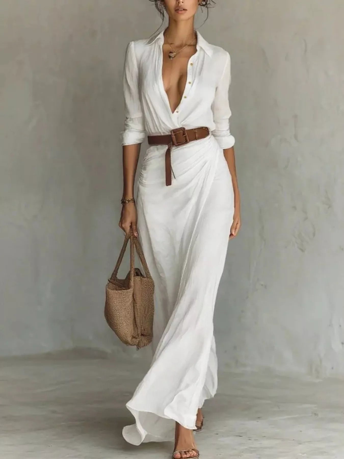 Front view of a white button front long sleeve shirt maxi dress with a brown belt