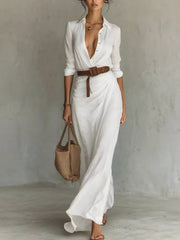 Front view of a white button front long sleeve shirt maxi dress with a brown belt