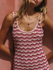 Upper front close view of a pink, cream and brown openwork chevron knit tank dress