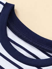 Close-up of the navy ribbed crew neckline and stitching on a striped children's T-shirt