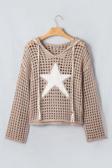 Mocha openwork crochet hooded cover up with white star and drawstrings hanging on a hanger.