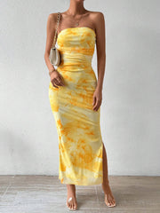 Yellow ruched strapless bodycon midi dress with abstract print and side slit, front view