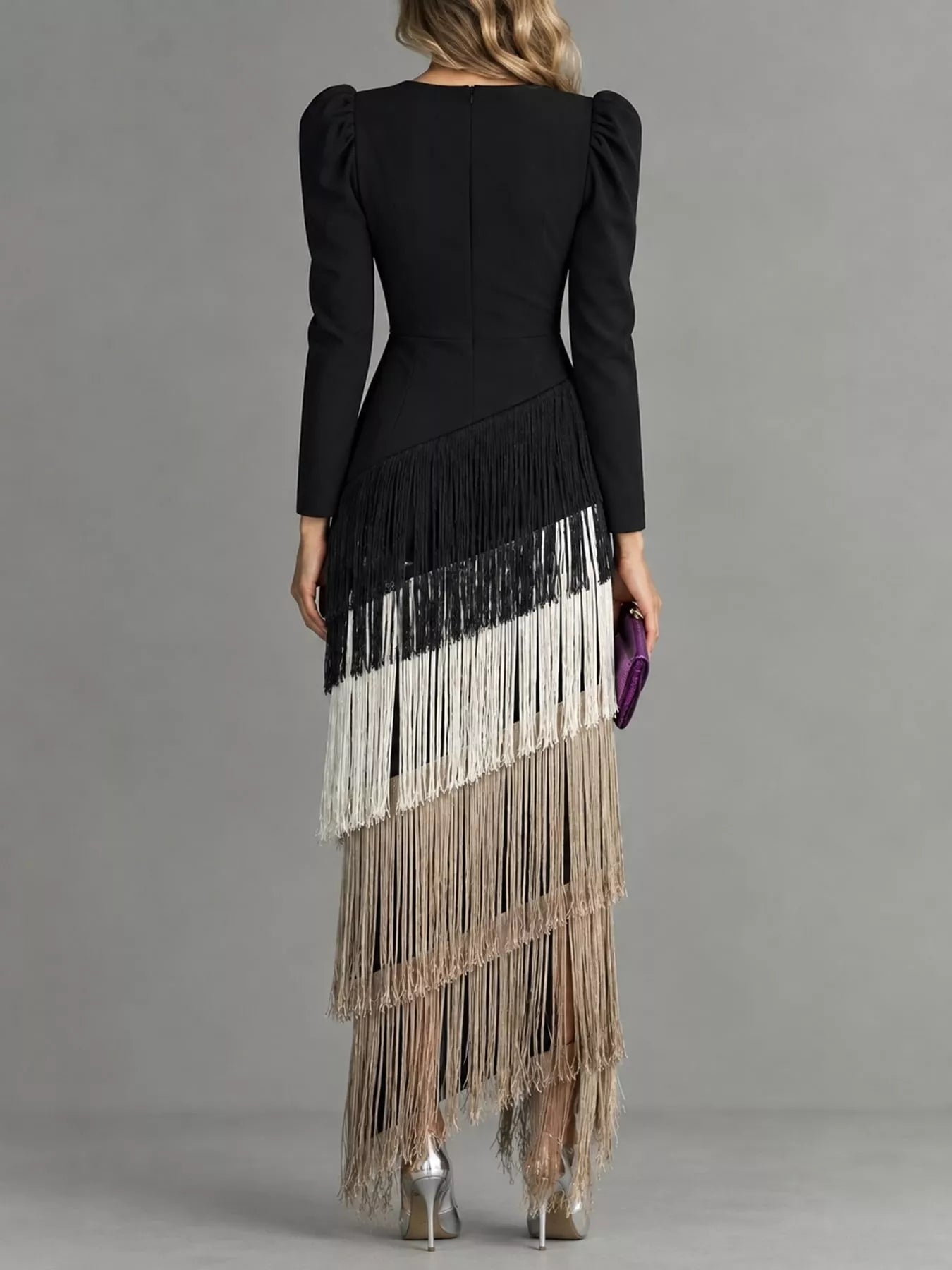 Studio back view of a black fringed maxi dress with cream and taupe fringe tiers