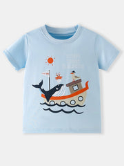 Flat front view of the light blue children's tee with whale boat and sun graphic