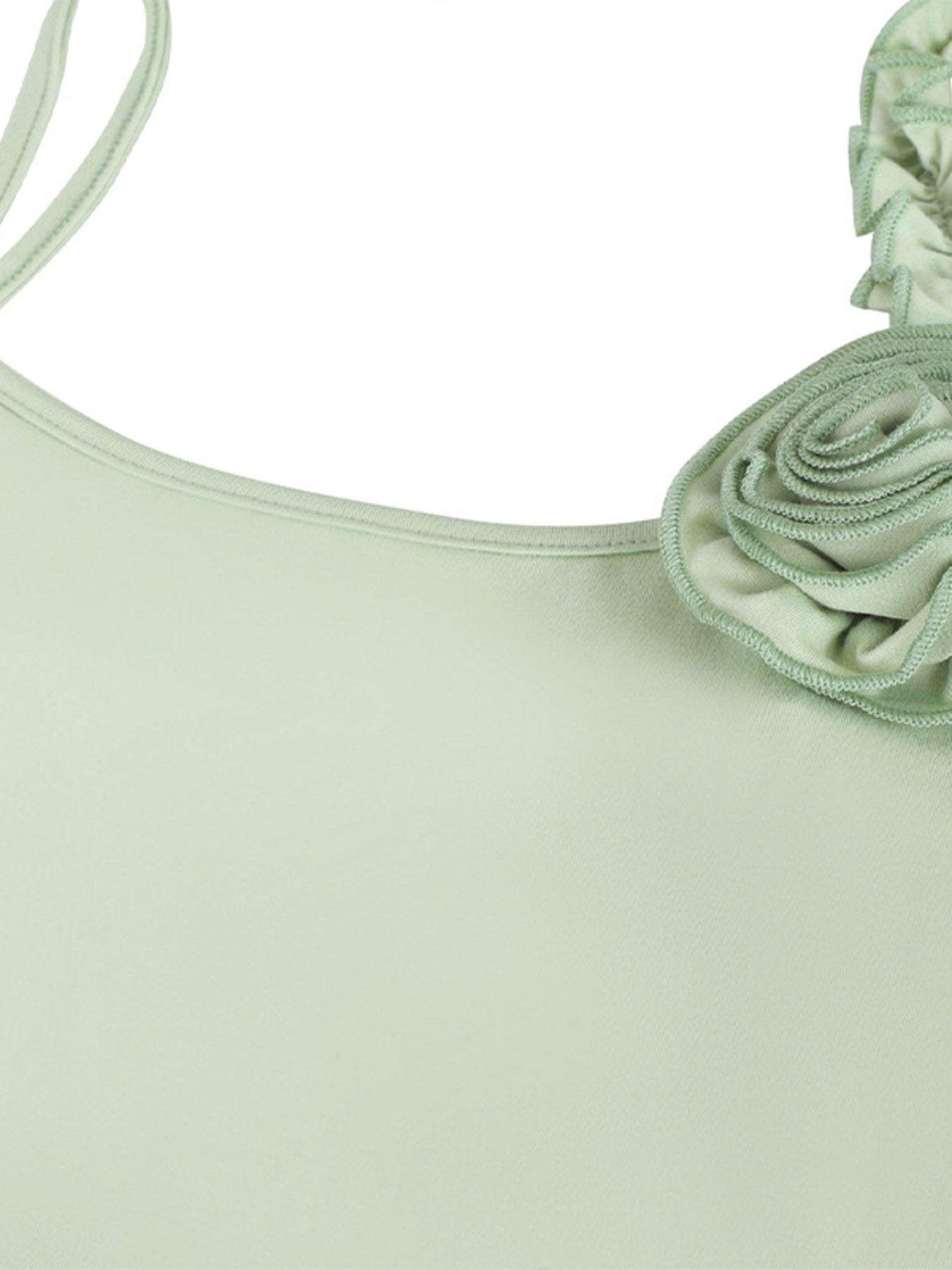 Close view of the light green fabric rose and neckline on a mermaid maxi dress