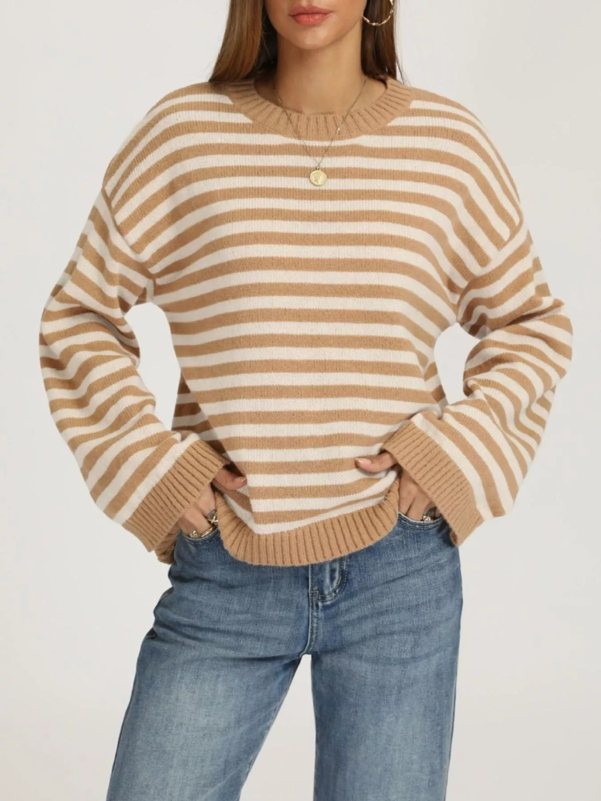 Front view of a khaki and white striped dropped shoulder sweater with ribbed cuffs and hem.