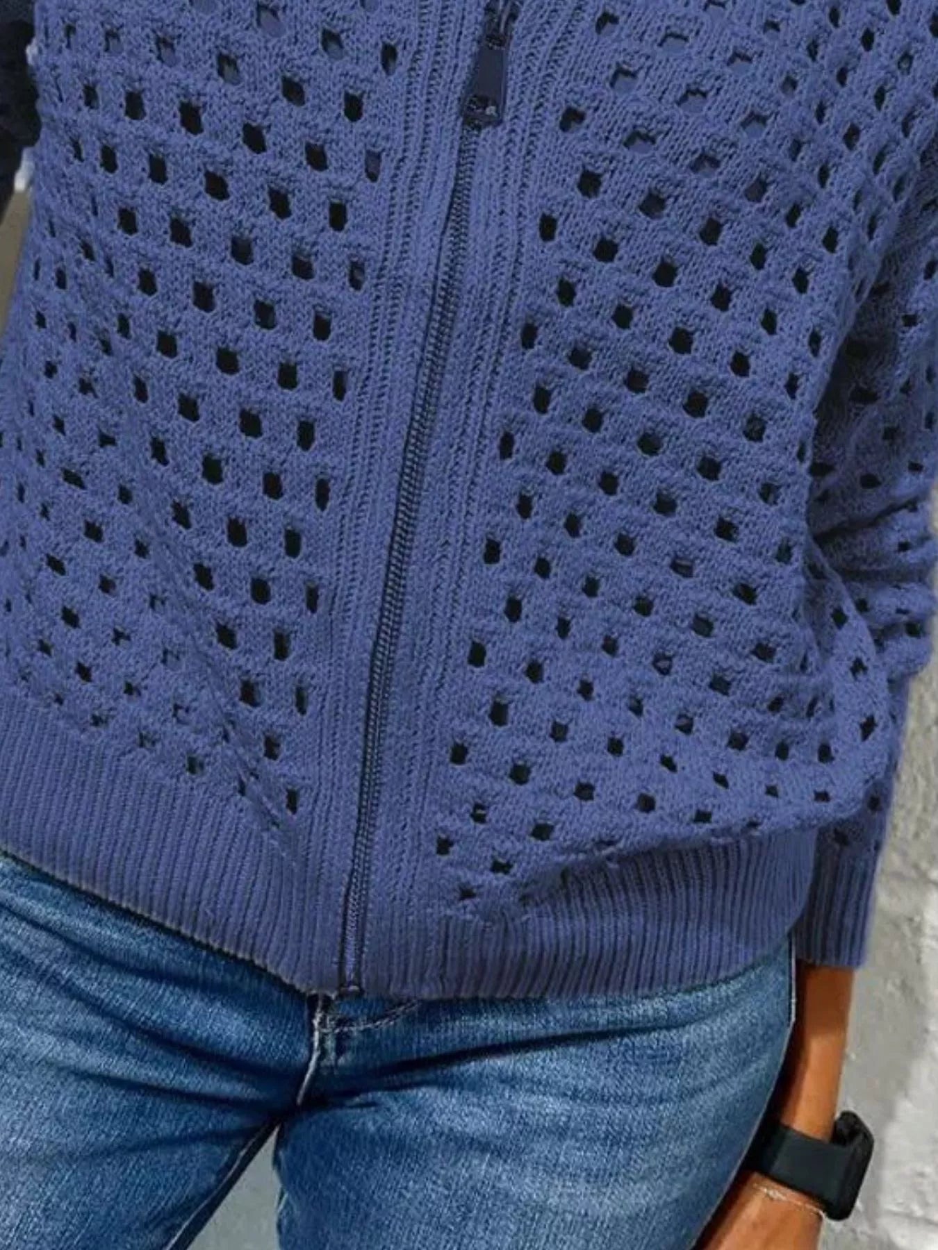 Close up of the blue crochet cardigan lower zip and ribbed hem