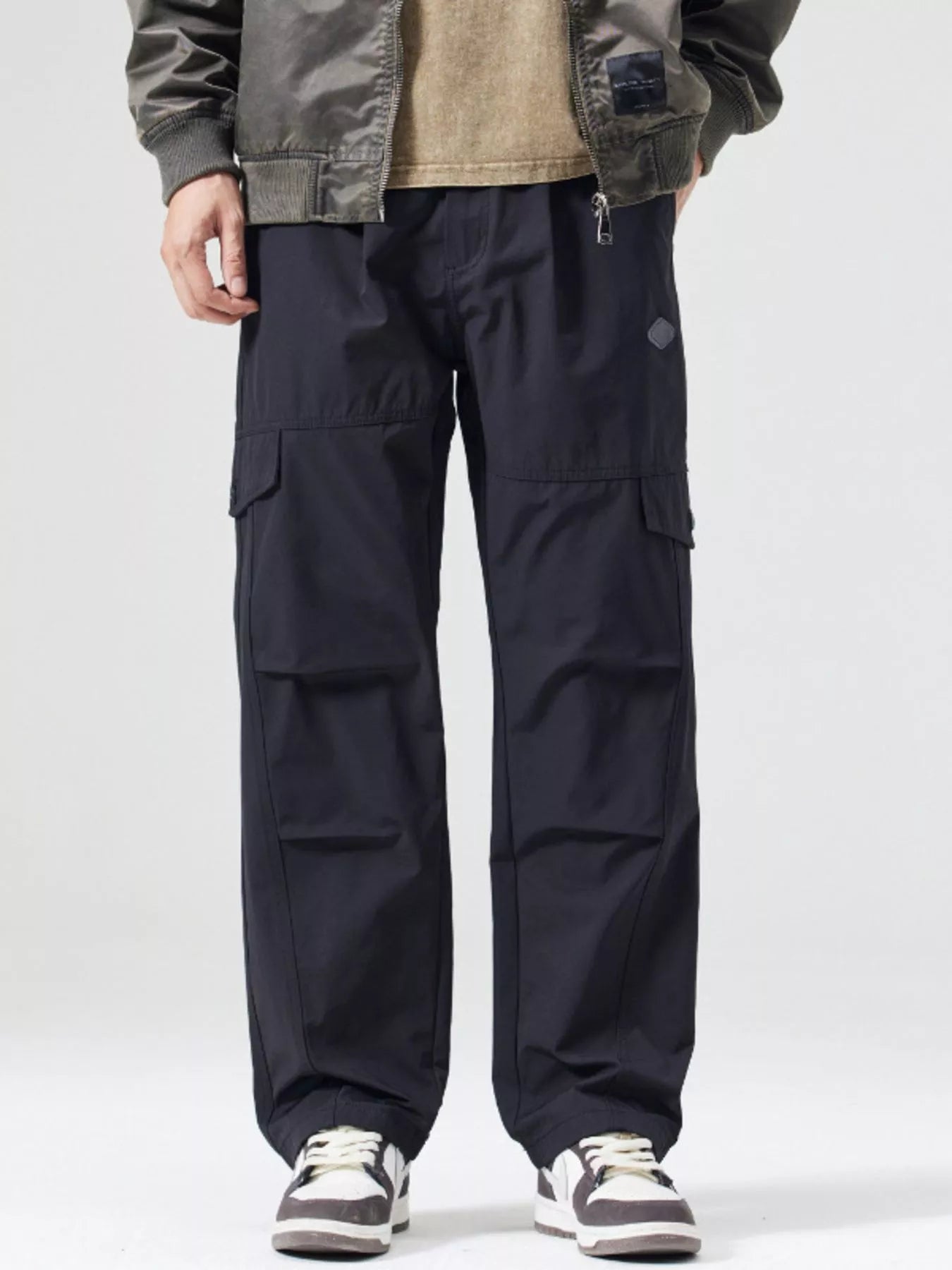Men's black wide-leg cargo pants with a drawstring waist and pockets.