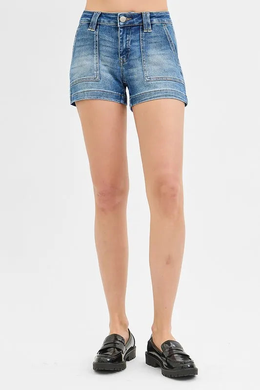 Women's low-rise washed shorts with patch pockets and raw hems.