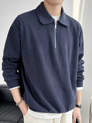 Men's ribbed corduroy polo with a half-zip neckline in a cotton-spandex blend.