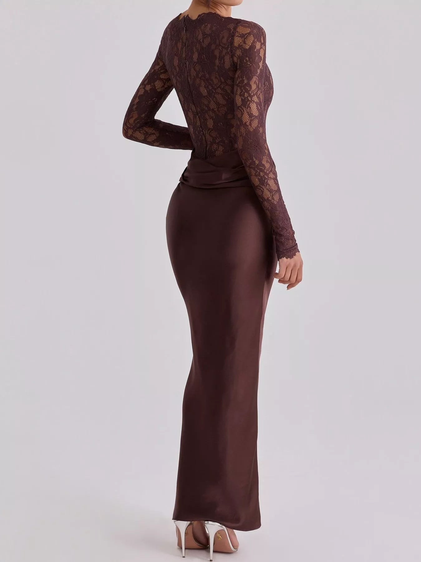 Back three quarter view of dark red lace bodice and satin maxi dress in studio