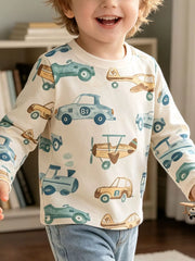 Cream children's long sleeve T-shirt shown worn with a blue and tan cars, planes and trains print