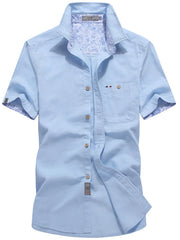 Men's short-sleeve button-up shirt with pocket detailing in a cotton-spandex blend.