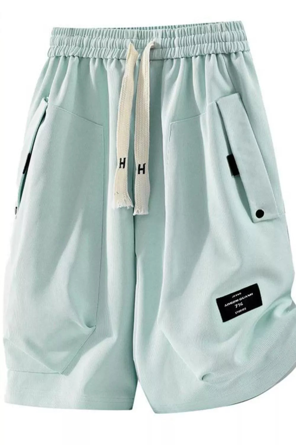 Men's sage lightweight shorts with a drawstring waist and pockets.