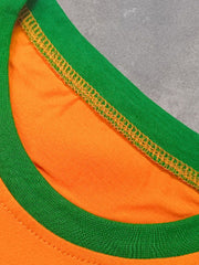 Close view of the green crew neckline with orange stitching on the orange children's T-shirt