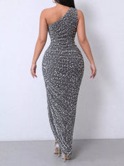 Grey sequin one shoulder evening dress worn from the back showing the ruched bodice