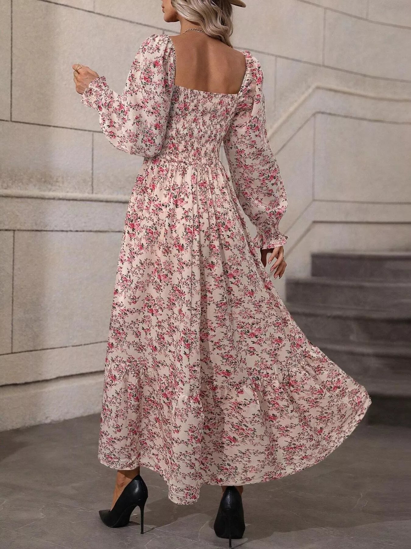Back view of pink floral midi dress showing open square back and long sleeves