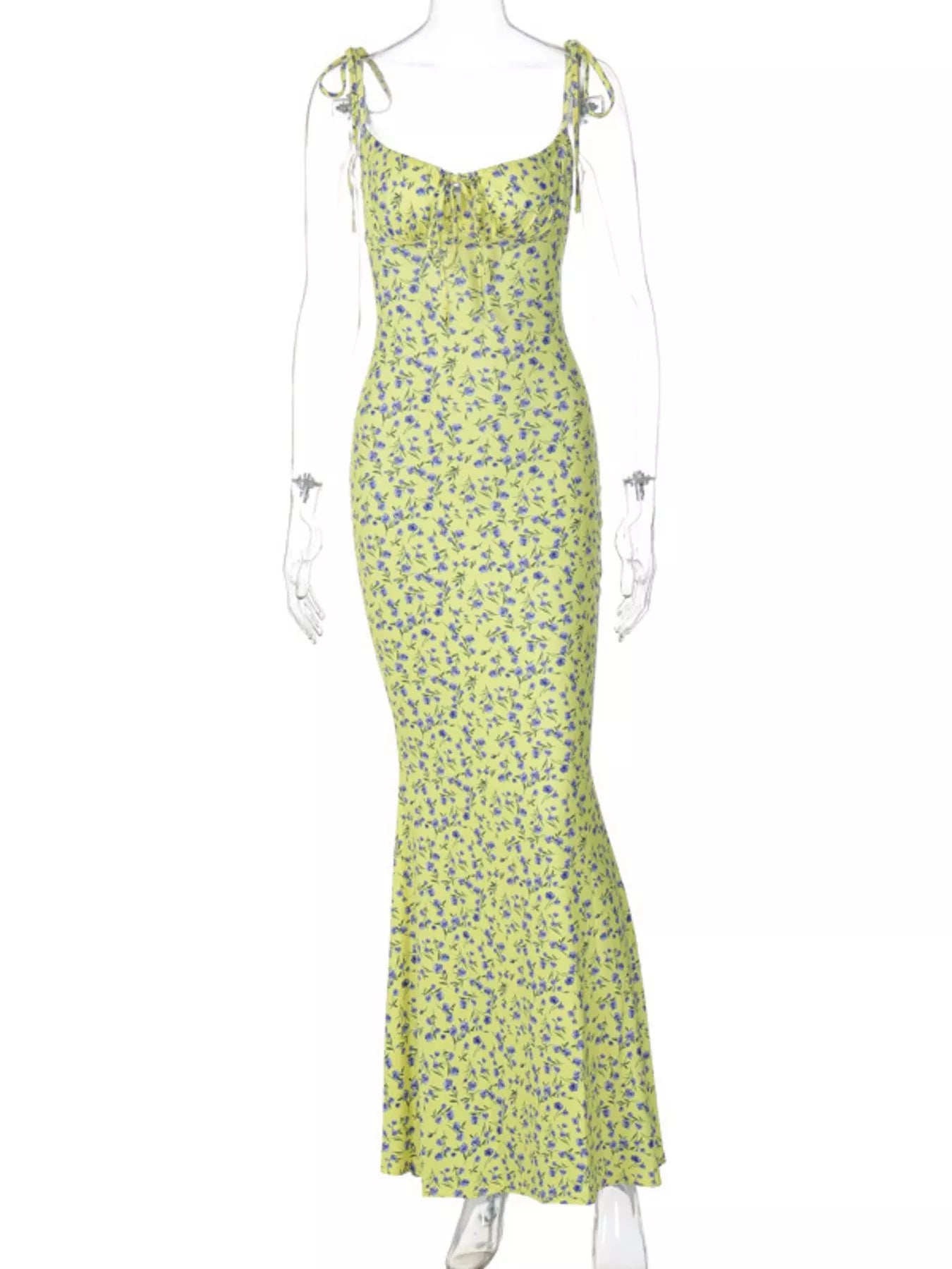Clear mannequin displaying yellow floral print bodycon maxi dress with tie straps on white background