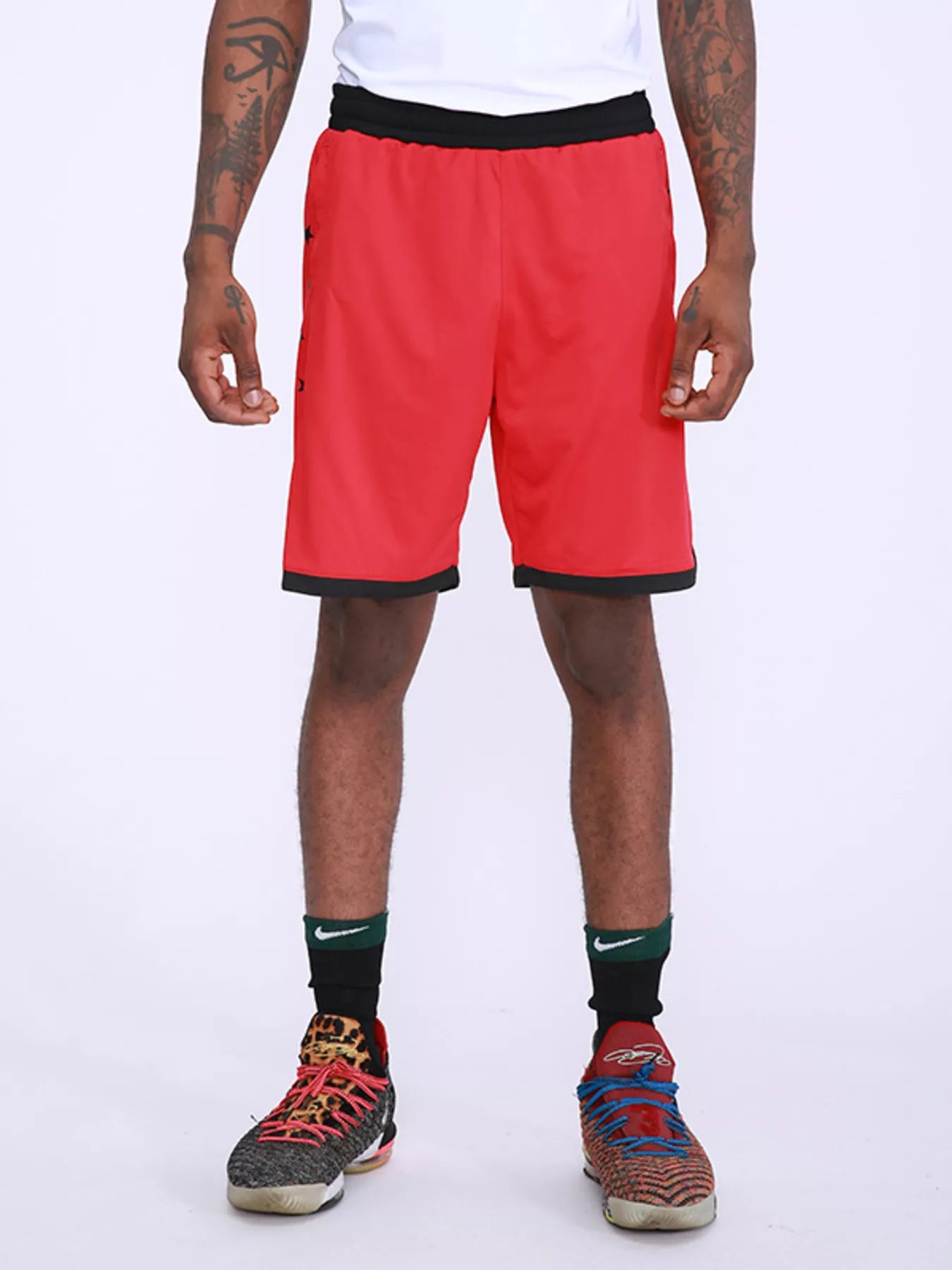 Men's red active shorts with star print and lightweight, breathable fabric.