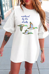 White oversized T-shirt featuring “weekend by the Lake” text and three colorful flying duck graphics