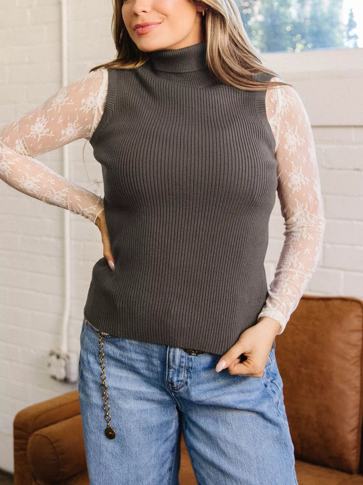 Coffee brown ribbed high neck sweater vest worn over sheer lace top