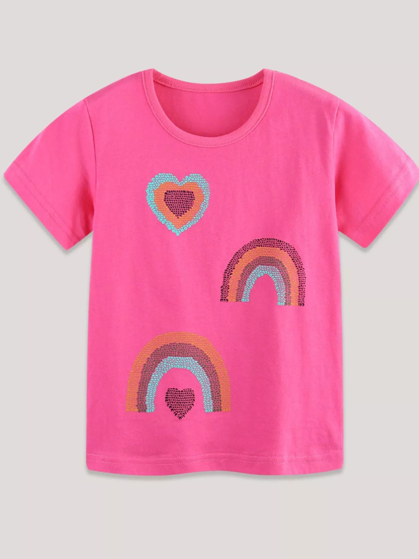 Flat front view of a hot pink children's tee with sequin hearts and rainbow motifs