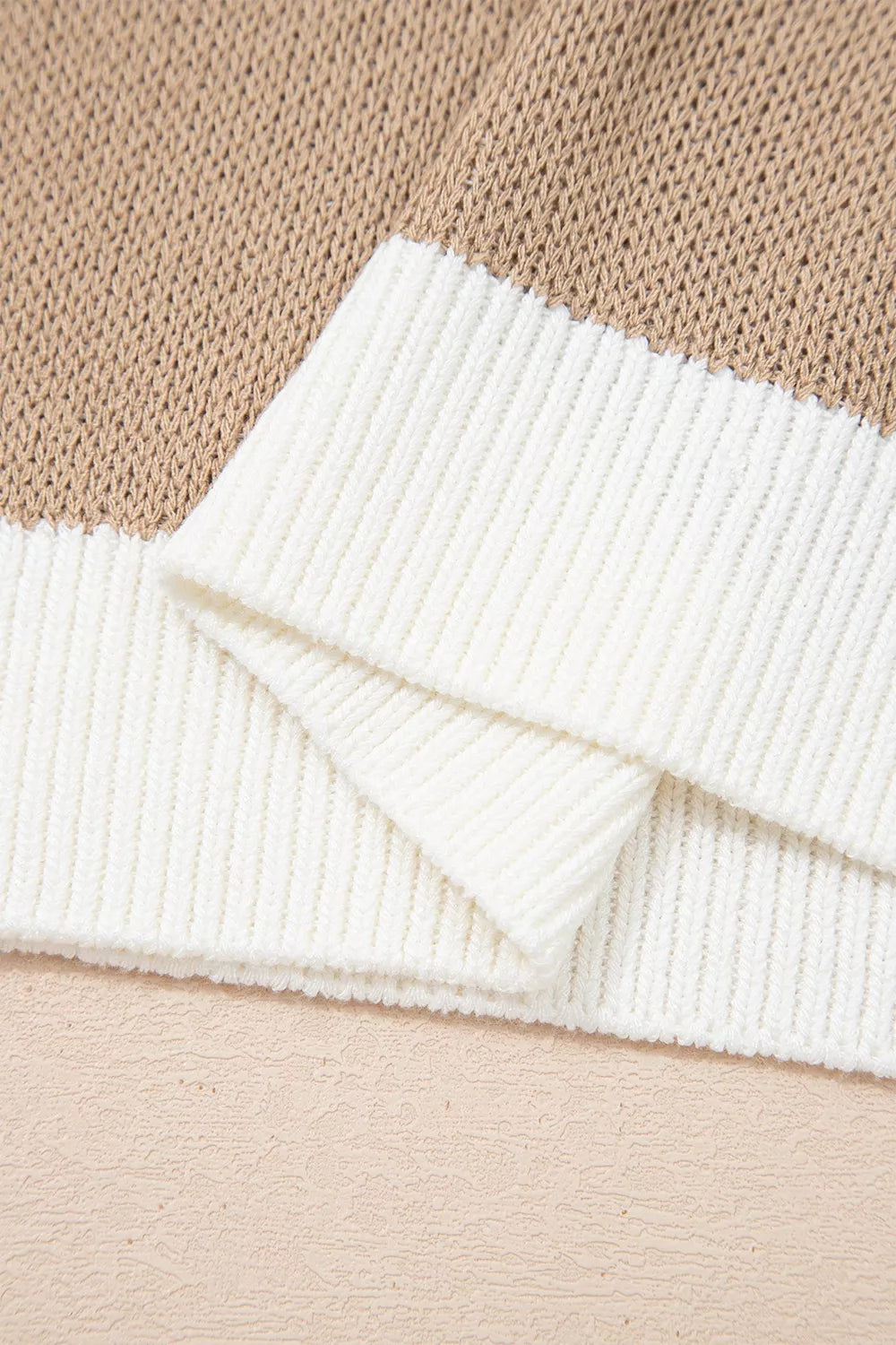 Close-up of the mocha sweater white ribbed hem trim
