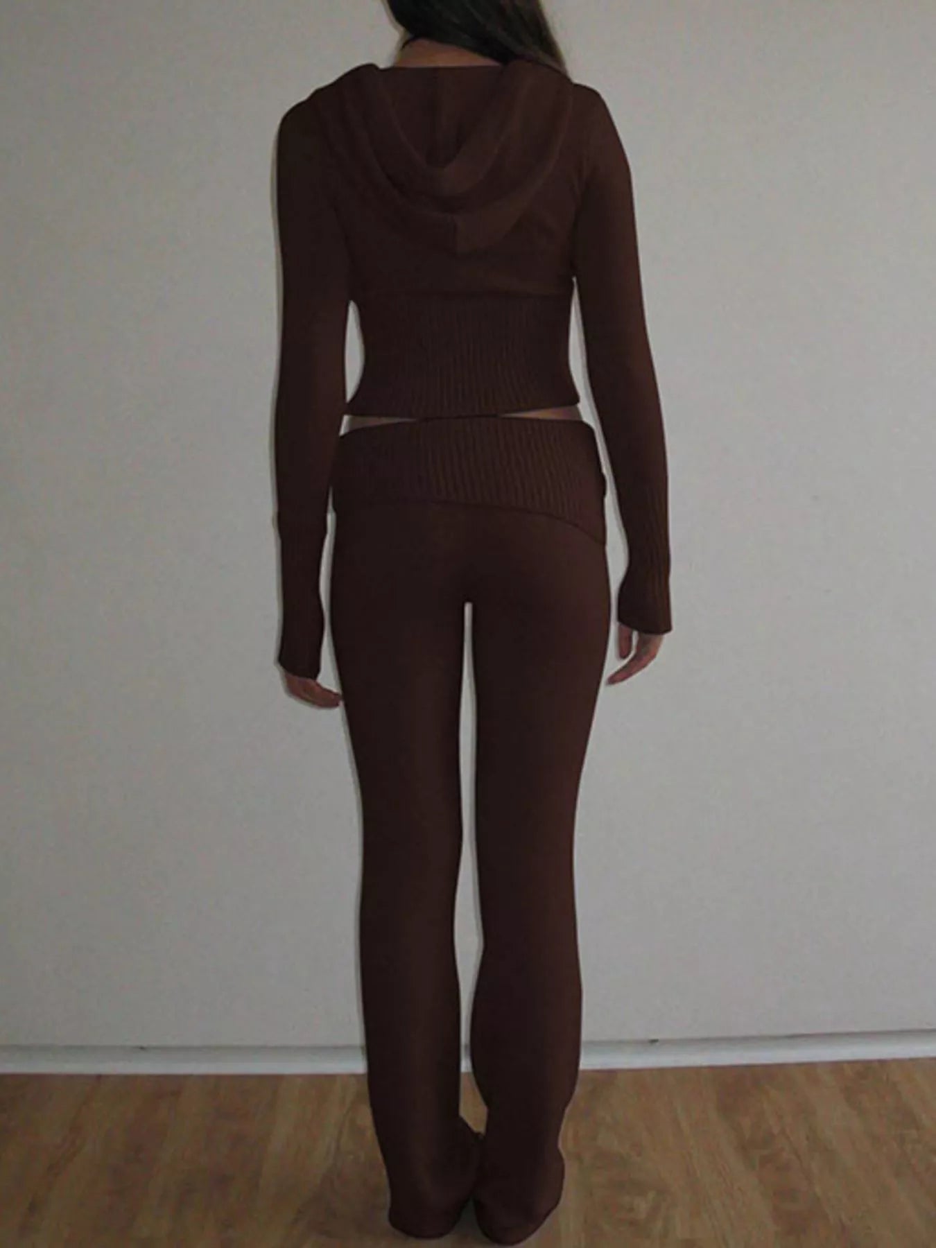 Back view of brown hooded cardigan and matching ribbed knit pants full length
